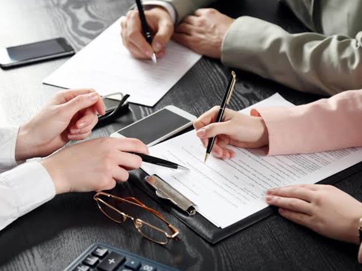 Consultants reviewing official business documents